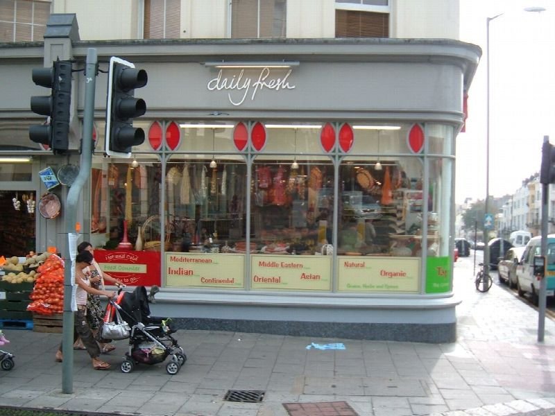 Small corner shop storefront on a city street