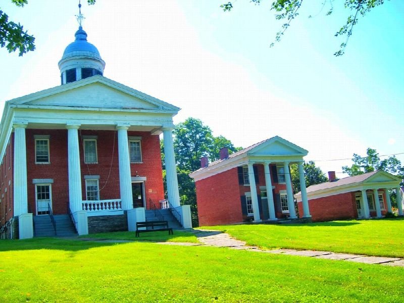 Brick county courthouse with a white cupola