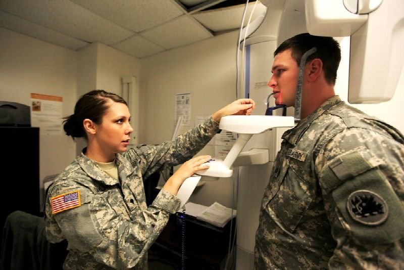 Patient positioned in a dental X-ray machine