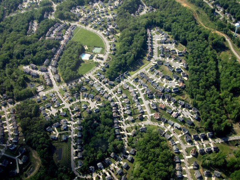 Aerial view of a suburban neighborhood with winding streets