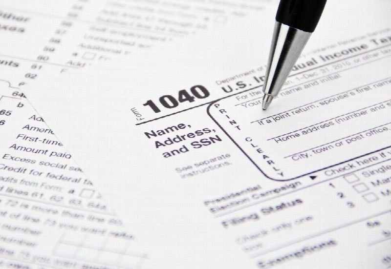 Pen resting on a US 1040 tax form